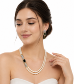 Pearl necklace & earring set with emerald green cz stone 2-layer strand, side brooch design, gold-tone bridal jewellery.