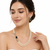 Pearl necklace & earring set with emerald green cz stone 2-layer strand, side brooch design, gold-tone bridal jewellery.