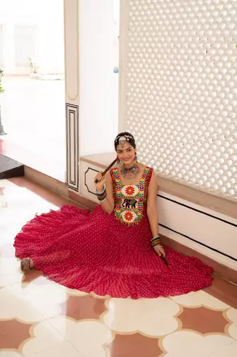 Rani Pink Color Bandhani Print work with kutchi patchework Faux Georgette Gown
