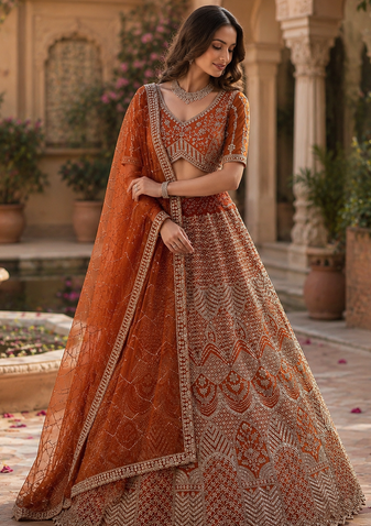 orange color Fancy Patten and Motif Crystal and Sequince work net Lehenga Choli set