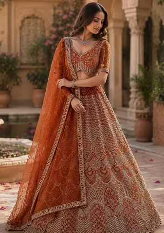 orange color Fancy Patten and Motif Crystal and Sequince work net Lehenga Choli set