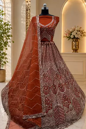 orange color Fancy Patten and Motif Crystal and Sequince work net Lehenga Choli set
