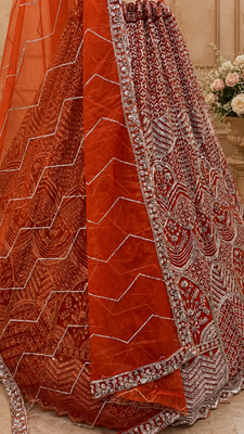 orange color Fancy Patten and Motif Crystal and Sequince work net Lehenga Choli set 3