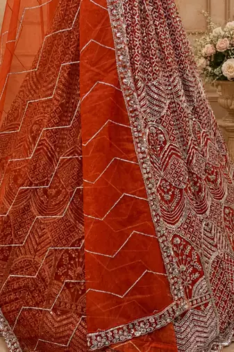 orange color Fancy Patten and Motif Crystal and Sequince work net Lehenga Choli set