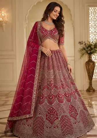 rani pink color Fancy Patten and Motif Crystal and Sequince work net Lehenga Choli set