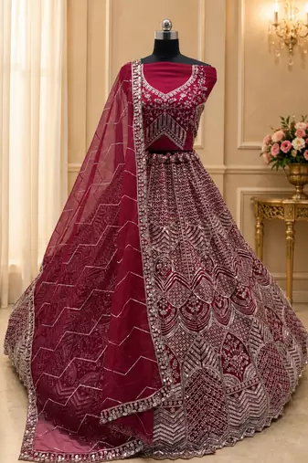 rani pink color Fancy Patten and Motif Crystal and Sequince work net Lehenga Choli set