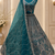 teal color Fancy Patten and Motif Crystal and Sequince work net Lehenga Choli set