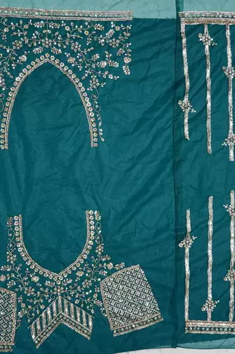 teal color Fancy Patten and Motif Crystal and Sequince work net Lehenga Choli set