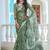 green cotton blend saree with floral print