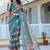 teal cotton blend saree with floral print