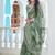green cotton blend saree with floral print