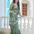 green cotton blend saree with floral print