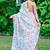 white beige cotton blend saree with floral print