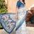 white blue cotton blend saree with floral border print