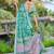 sea green cotton blend saree with floral border print