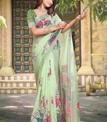 green cotton blend saree with floral print