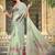 green cotton blend saree with floral print