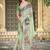green cotton blend saree with floral print