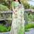 green cotton blend saree with floral print