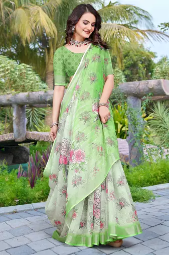 green cotton blend saree with floral print