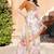 white orange cotton blend saree with floral border print