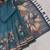 blue shimmer handloom cotton blend saree with floral border print