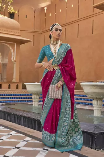 Pink Elora woven designed patola silk blend saree.