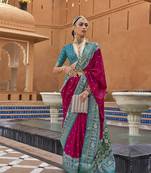 Pink Elora woven designed patola silk blend saree.