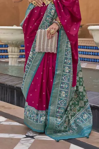 Pink Elora woven designed patola silk blend saree.