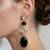 Gold plated black stone crystal dangler earrings