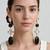Gold plated black stone crystal dangler earrings