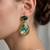 Gold plated green stone swarovski crystal dangler earrings