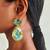 Gold plated green stone swarovski crystal dangler earrings