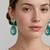 Gold plated turquoise stone mint green crystal dangler earrings