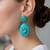 Gold plated turquoise stone dangler earrings