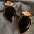 Gold plated black and white crystal stud earrings