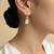 Gold plated green polki drop earrings