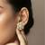 Gold plated yellow polki floral stud earrings
