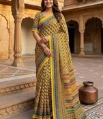 Women   s mustard yellow printed saree with traditional beautiful print and with real mirror work