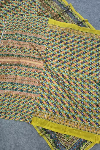 Women   s mustard yellow printed saree with traditional beautiful print and with real mirror work