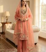 Peach heavy embroidered kurti pant set with lace dupatta for festive wear
