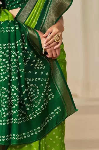 Kalini women dola silk bandhani print zari border saree