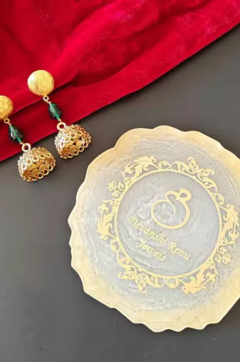 Gold plated green drop jhumka earrrings