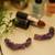 Gold plated purple round danglers earrings
