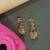 Gold plated beaded dangler earrings