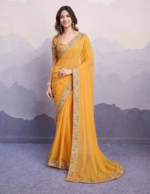 Yellow georgette thared work embroidery border & leheriya printed saree whit blouse 1