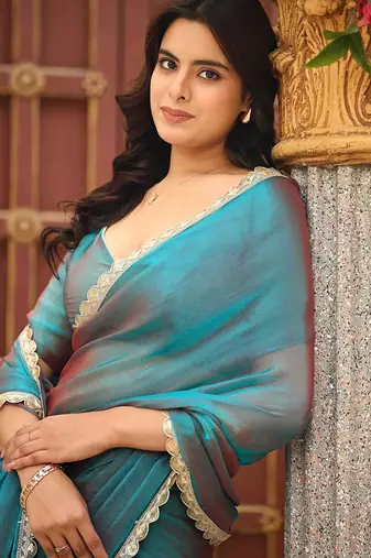 Teal chiffon embroidery work lace border solid saree whit blouse