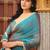 Teal chiffon embroidery work lace border solid saree whit blouse