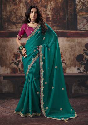 Teal green faux chiffon saree with zari embroidered border & magenta pink blouse 1