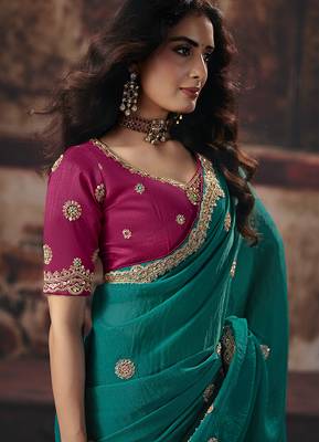 Teal green faux chiffon saree with zari embroidered border & magenta pink blouse 2